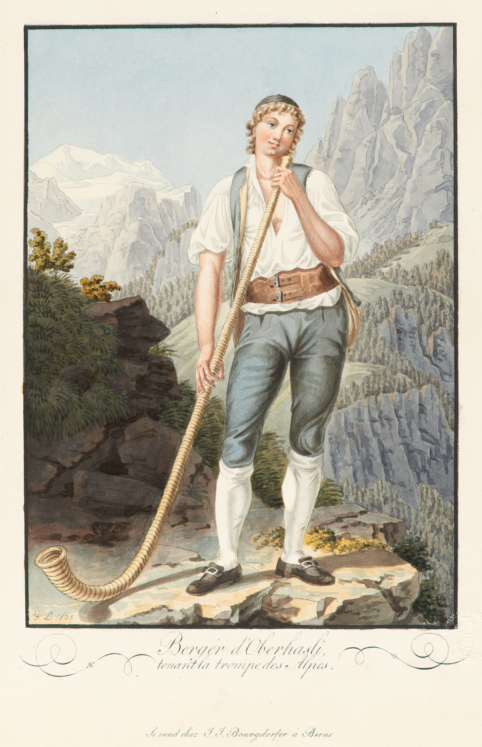 Junger Hirte mit einem Alphorn in der Hand auf einem Felsen stehend 